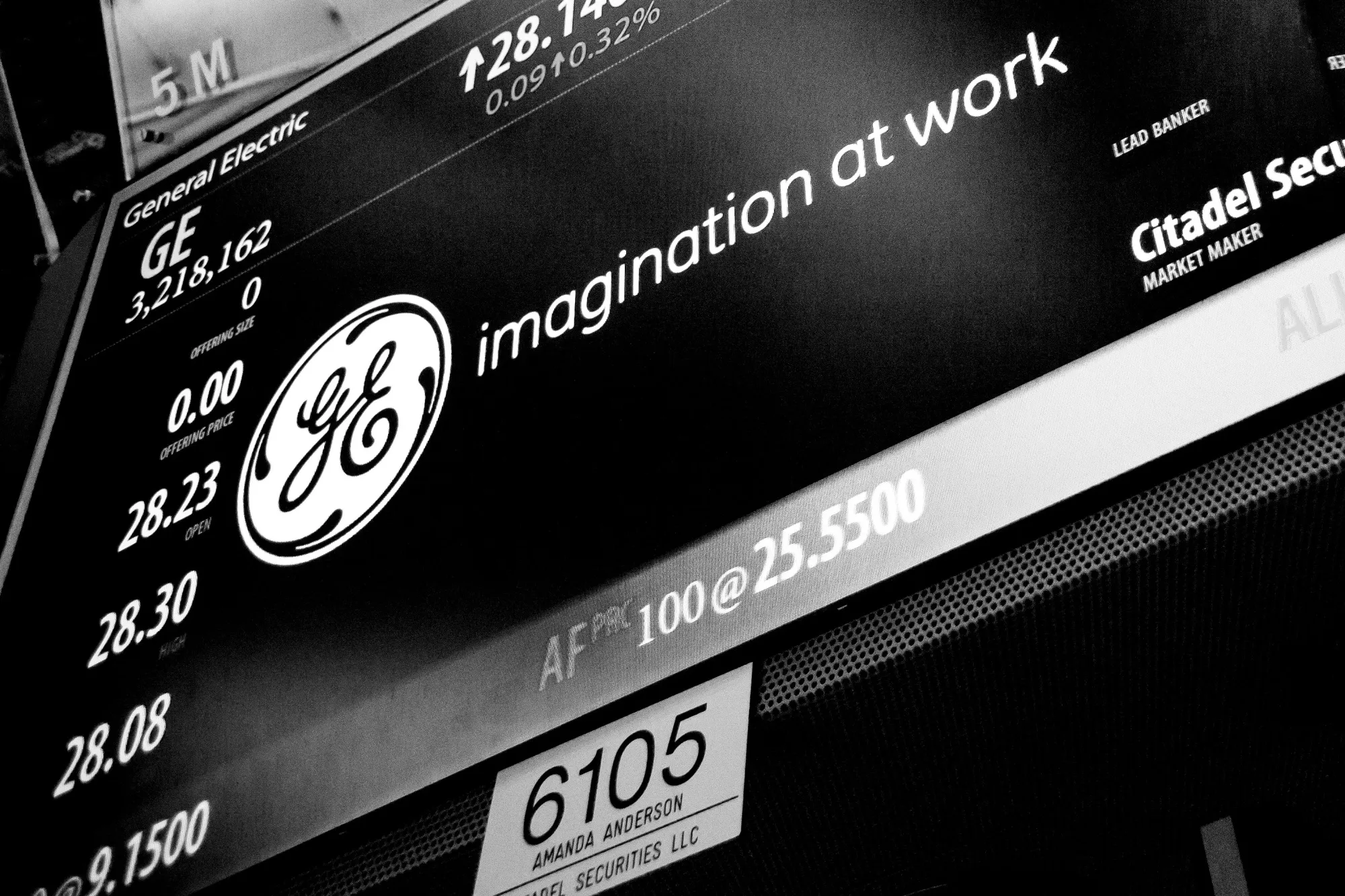 A monitor displays General Electric Corp. signage on the floor of the New York Stock Exchange (NYSE) in New York, U.S., on Monday, May 22, 2017. U.S. stocks advanced for a third day as President Donald Trump's trip to Saudi Arabia netted deals that lifted industrial shares and crude pushed above $50 a barrel before OPEC meets this week.
