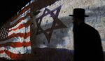 The Israeli and U.S. flags are projected on the walls of Jerusalem's Old City, to mark one year since the transfer of the U.S. Embassy from Tel Aviv to Jerusalem, on May 15.