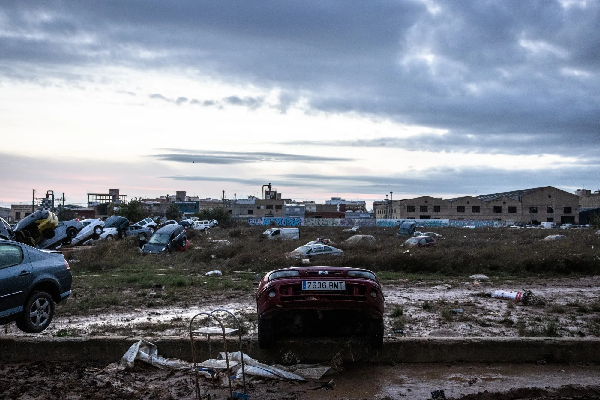 Vehicles damaged by extreme flooding in Alfafar, Spain.