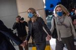 Elizabeth Holmes, founder of Theranos Inc., center, outside of federal court with mother Noel Holmes in San Jose, California.