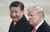 China's President Xi Jinping (L) and U.S. President Donald Trump attend a welcome ceremony at the Great Hall of the People in Beijing on Nov. 9, 2017.
