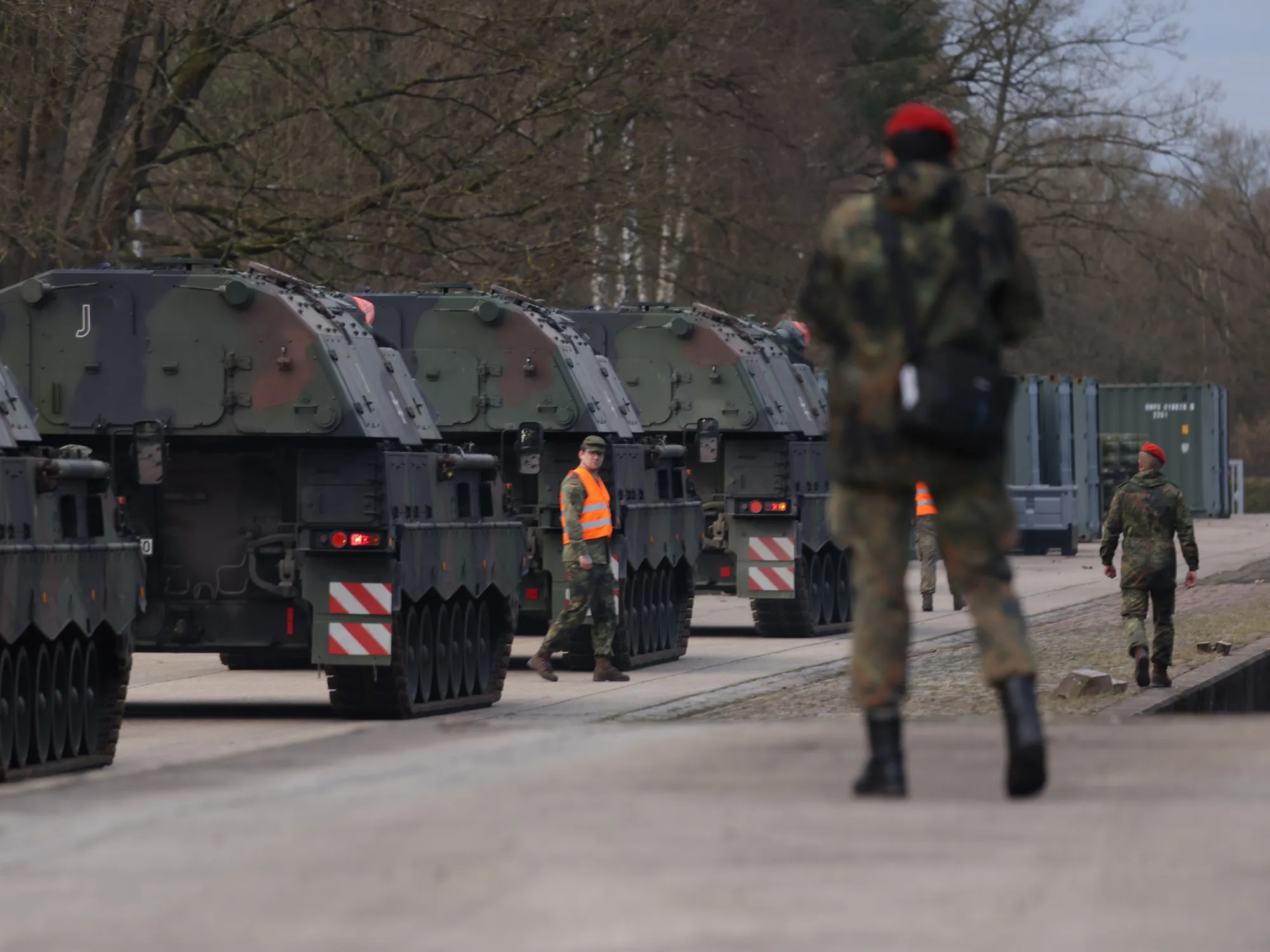 German soldiers prepare self-propelled howitzers for transport, in Munster, Germany.