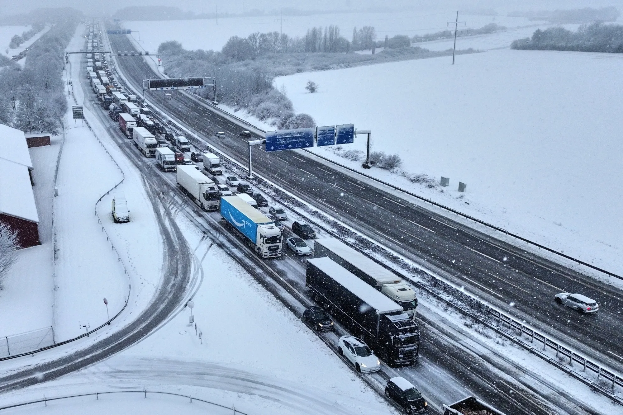 Traffic queues on a highway following heavy snow fall in Frankfurt, on Feb. 19.