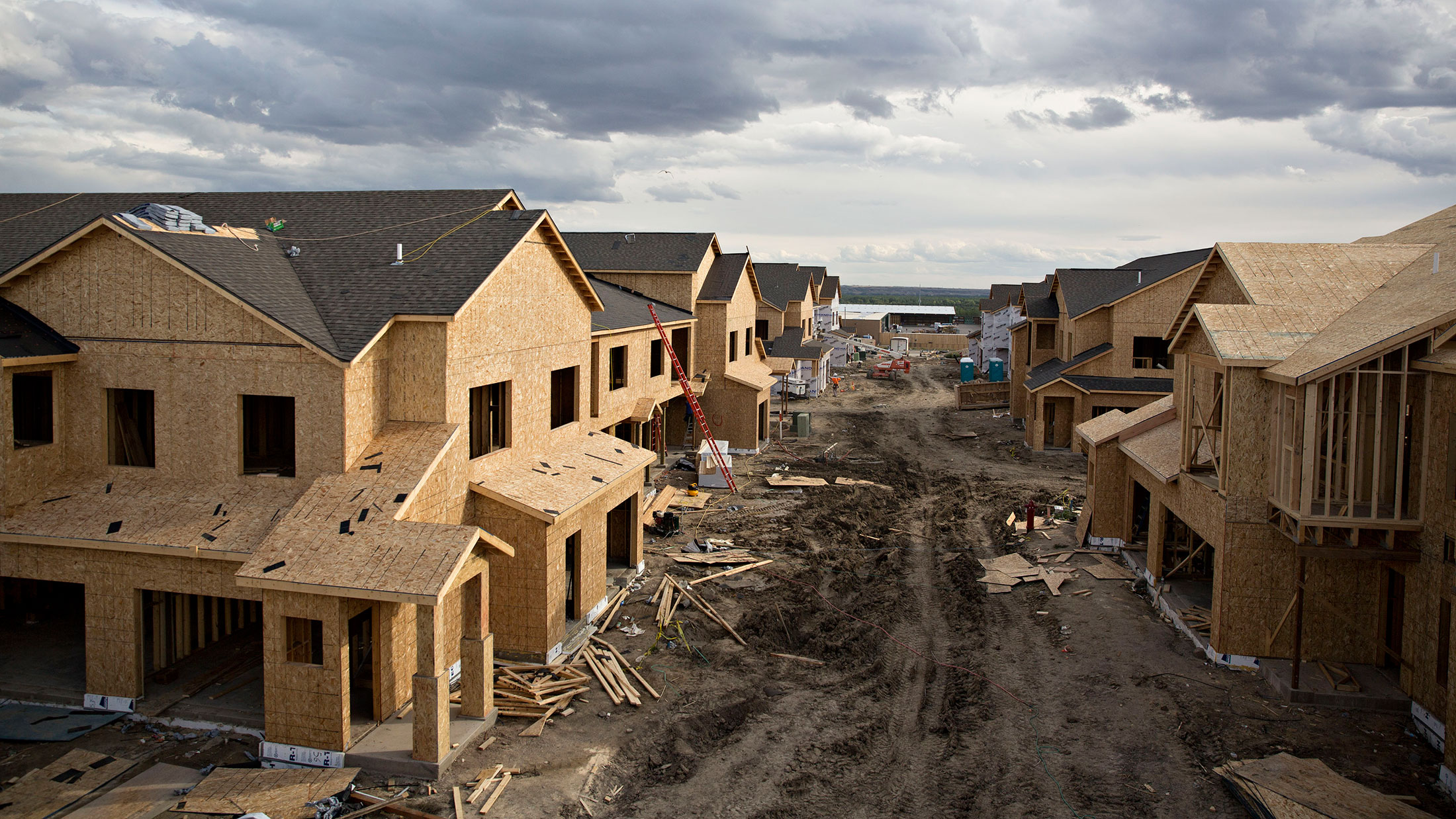 Partially completed buildings stand during construction at the Williston Apartments luxury apartment complex in Williston, North Dakota, on Sept. 9, 2015.
