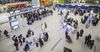 Travelers gather inside the check-in area for JetBlue Airways Corp. at Logan International Airport.