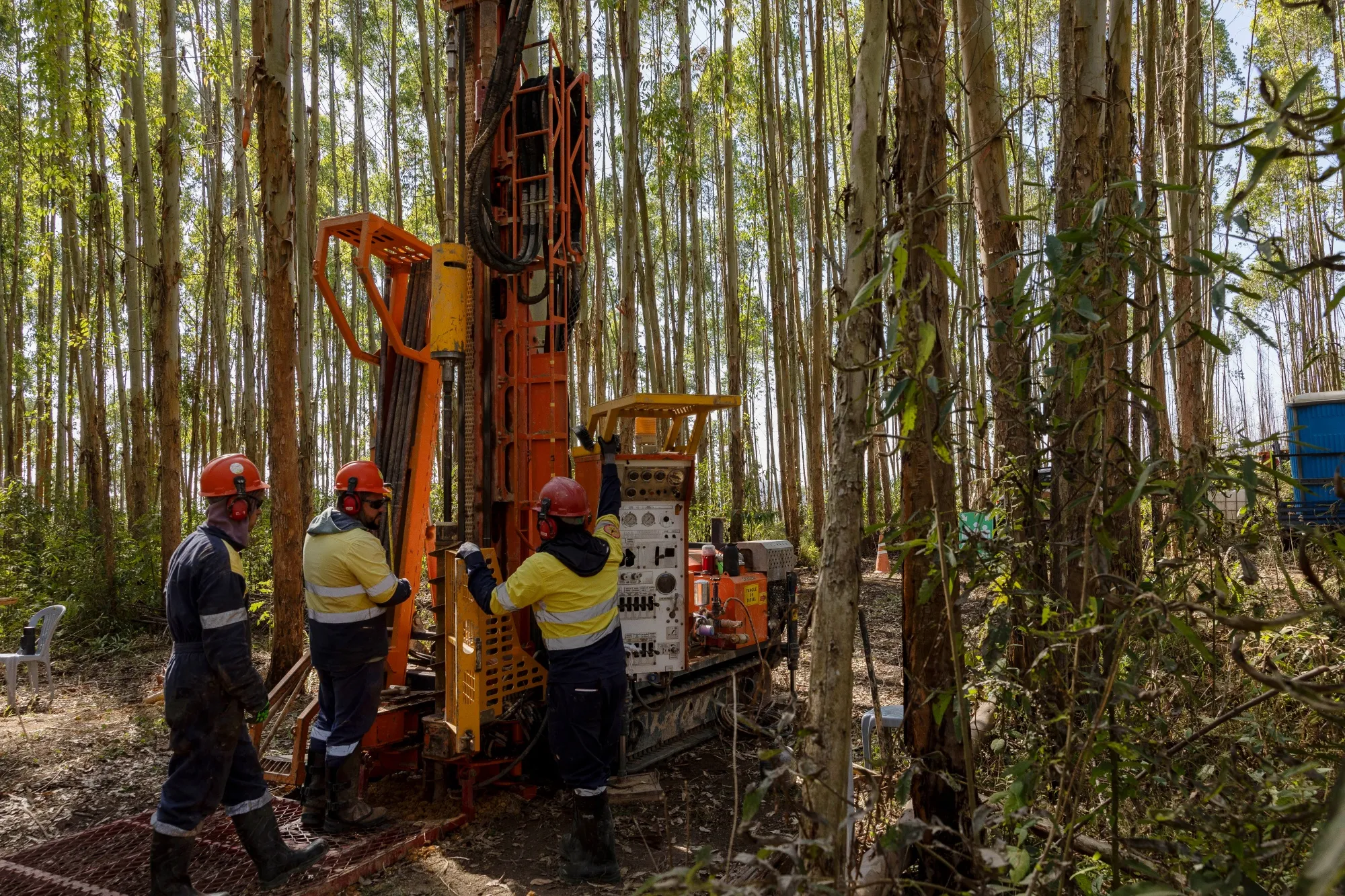 Workers drill for soil samples at a Meteoric Resources rare earth exploration project in Caldas Novas, Minas Gerais state, Brazil.