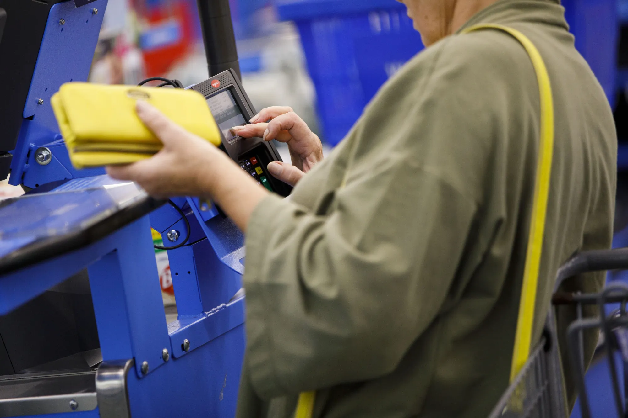 A customer uses a credit card terminal at a store&nbsp;in Burbank, California.