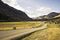 The ranch is set in a green valley between two mesas.