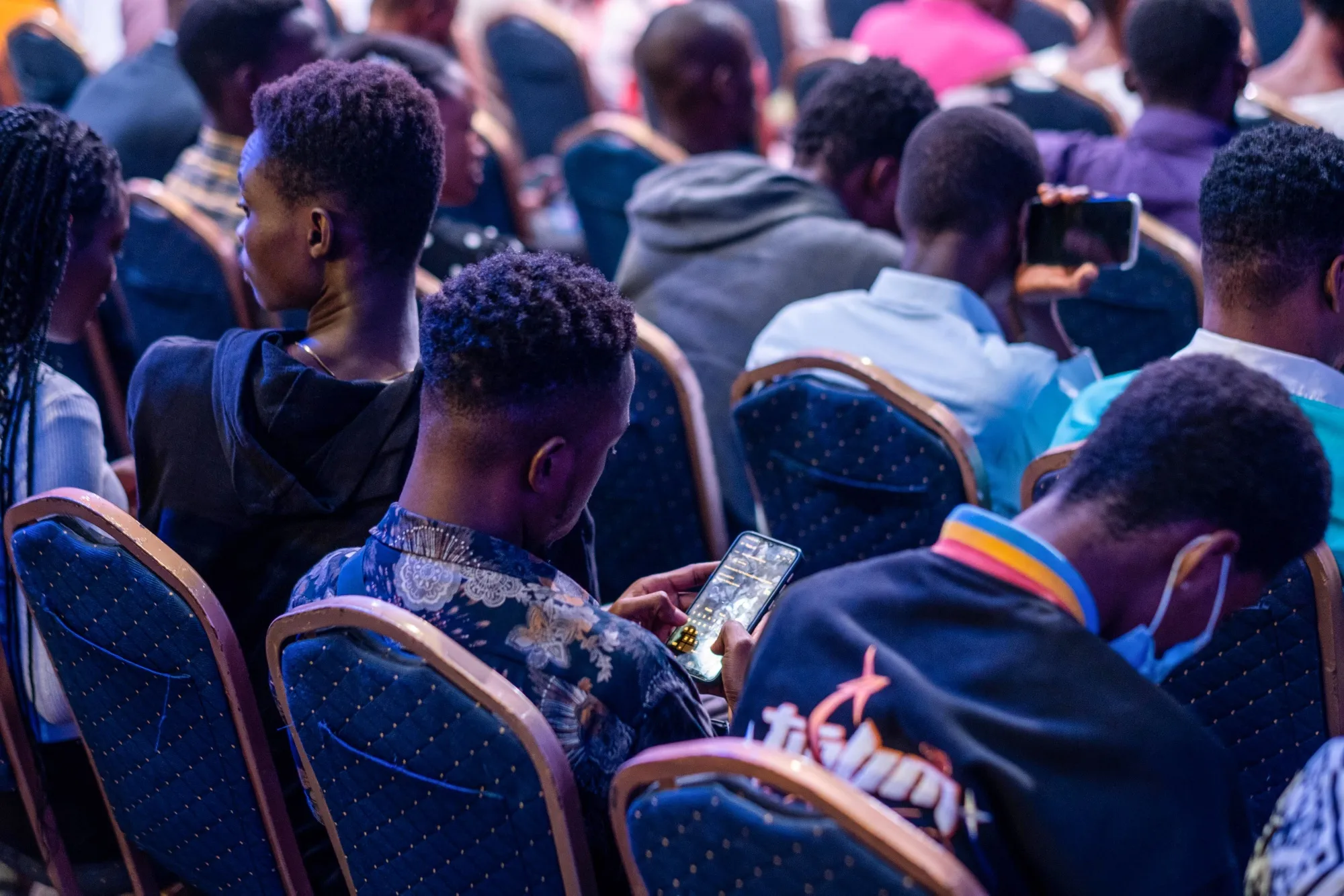 An attendee uses a smartphone during a conference in&nbsp;Lagos, Nigeria.&nbsp;