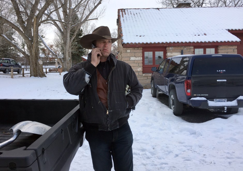 Ryan Bundy talks on the phone at the Malheur National Wildlife Refuge near Burns, Oregon, on Sunday, Jan. 3, 2016. Bundy is one of the protesters occupying the refuge to object to a prison sentence for local ranchers for burning federal land.