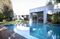 The property includes a main home, horse stables, and manicured grounds.