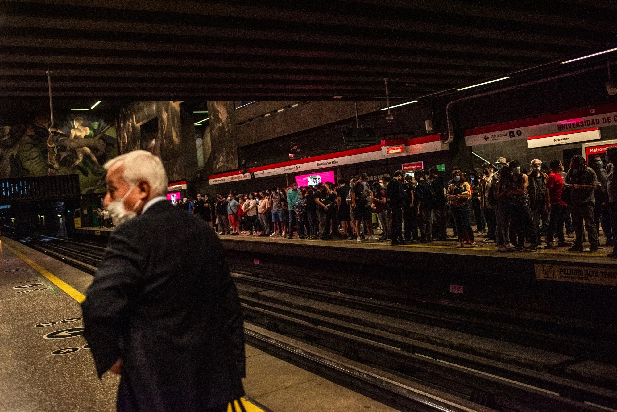Commuters wait for a train at a subway station in Santiago, Chile, on&nbsp;March 28.