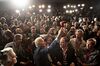 Joe Biden, center, takes a 'selfie' photograph with supporters during a caucus night watch party in Des Moines, Iowa, on Feb. 3.