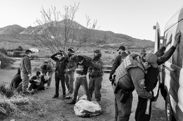 US Customs and Border Protection agents apprehend migrants in Sunland Park, New Mexico, on April 10.