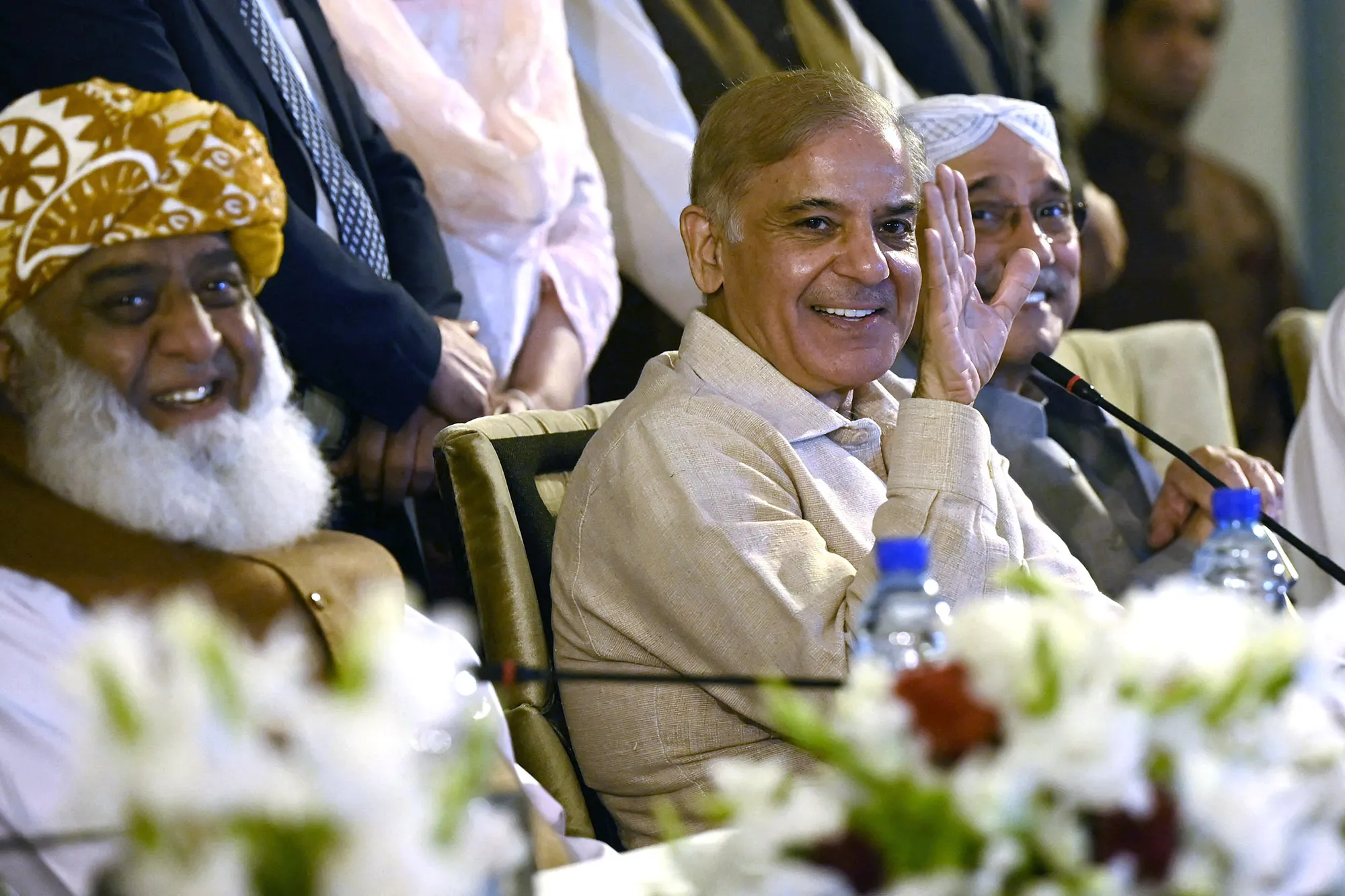 Shahbaz Sharif, Asif Ali Zardari and Fazlur Rehman during a news&nbsp;conference in Islamabad, on March 28.&nbsp;