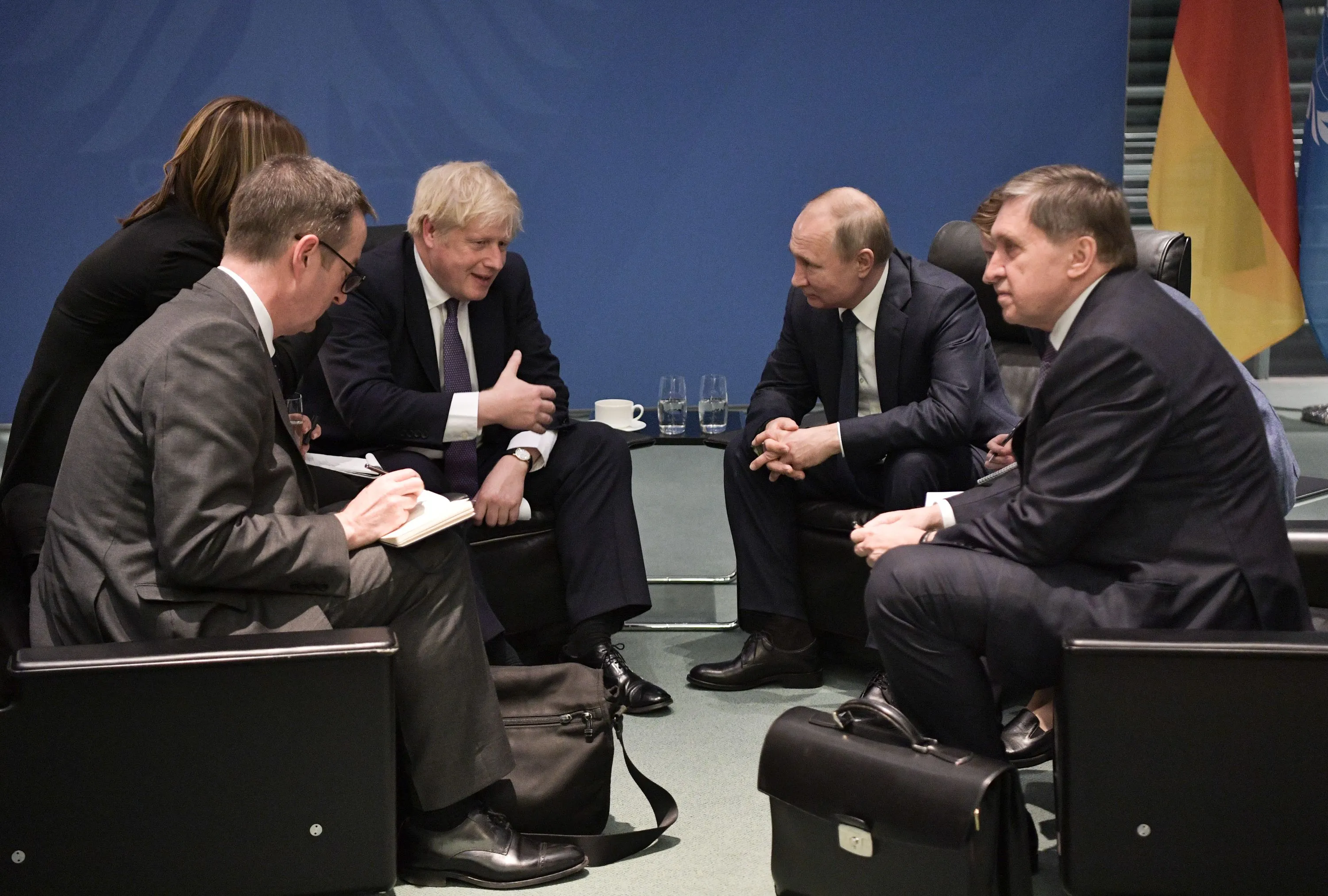Boris Johnson, center left, and Vladimir Putin meet on the sidelides of a Peace summit on Libya in Berlin in January 2020.&nbsp;