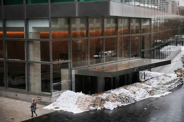 Sandbags are stacked at the entrance to the Goldman Sachs Group headquarters in New York in preparation for superstorm Sandy