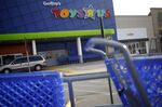Shopping carts stand outside a Toys R Us Inc. retail store in Louisville, Kentucky.