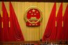 The Chinese national emblem is seen during a vote to repeal presidential term limits at a session at the first session of the 13th National People's Congress (NPC) at the Great Hall of the People in Beijing, China, on Sunday, March 11, 2018. China's parliament voted to repeal presidential term limits, allowing President Xi Jinping to retain power indefinitely in a formal break from succession rules set up after Mao Zedong's turbulent rule.