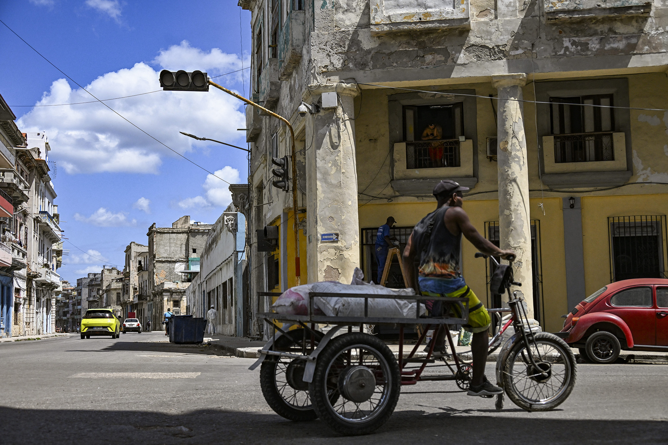 A man rides a tricycle during a blackout in Havana, Cuba, on March 16, 2026. Photographer: Yamil Lage/AFP