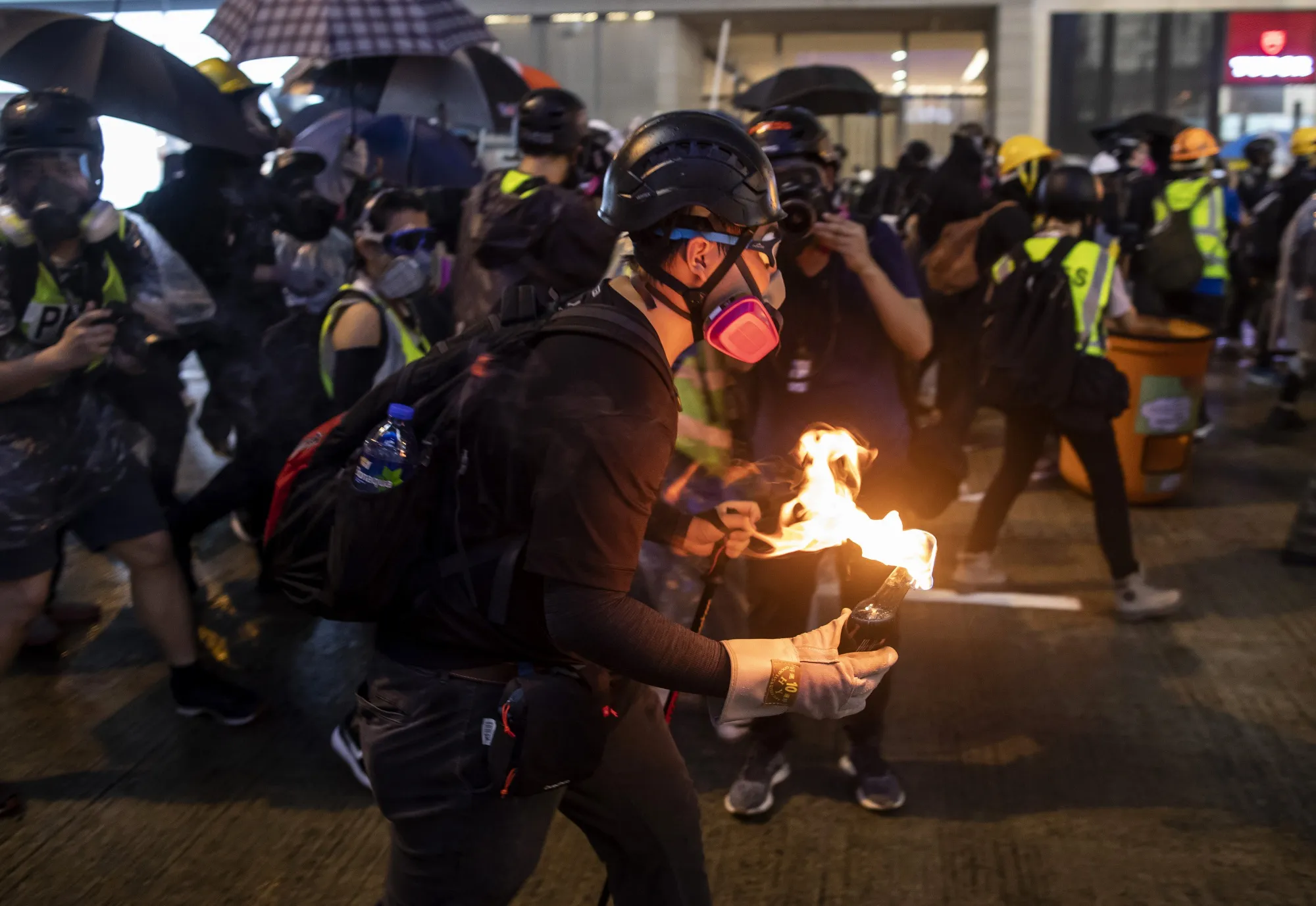 A demonstrator prepares to throw a fire&nbsp;bomb towards riot police&nbsp;in the Causeway Bay district of Hong Kong&nbsp;on&nbsp;Aug. 31, 2019.