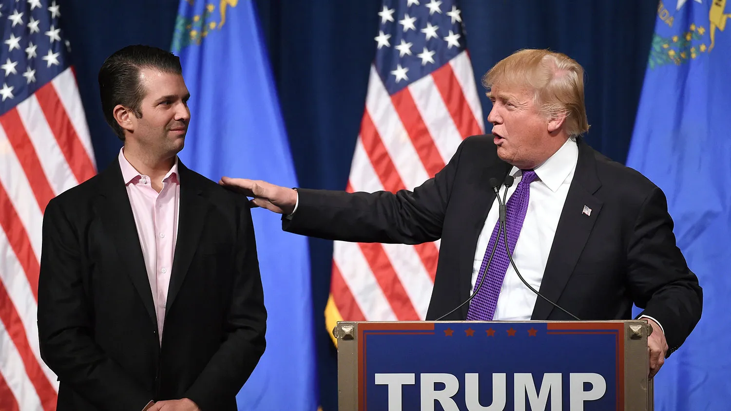 Donald Trump Jr. looks on as his father, Republican presidential candidate Donald Trump, speaks on Feb. 23, 2016, in Las Vegas.
