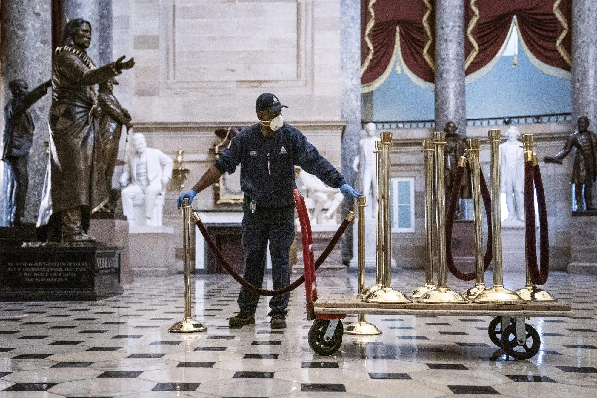 A Capitol Hill worker creates socially distanced spaces for members of the House of Representatives&nbsp;in the U.S. Capitol in Washington, D.C., U.S.