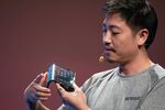 Bill Liu holds a Royole Corp. Flexpai smartphone in 2019.