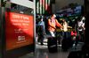 Travelers walk through Newark International Airport in Newark, New Jersey, on Nov. 21.