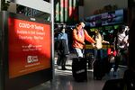 Travelers walk through Newark International Airport in Newark, New Jersey, on Nov. 21.