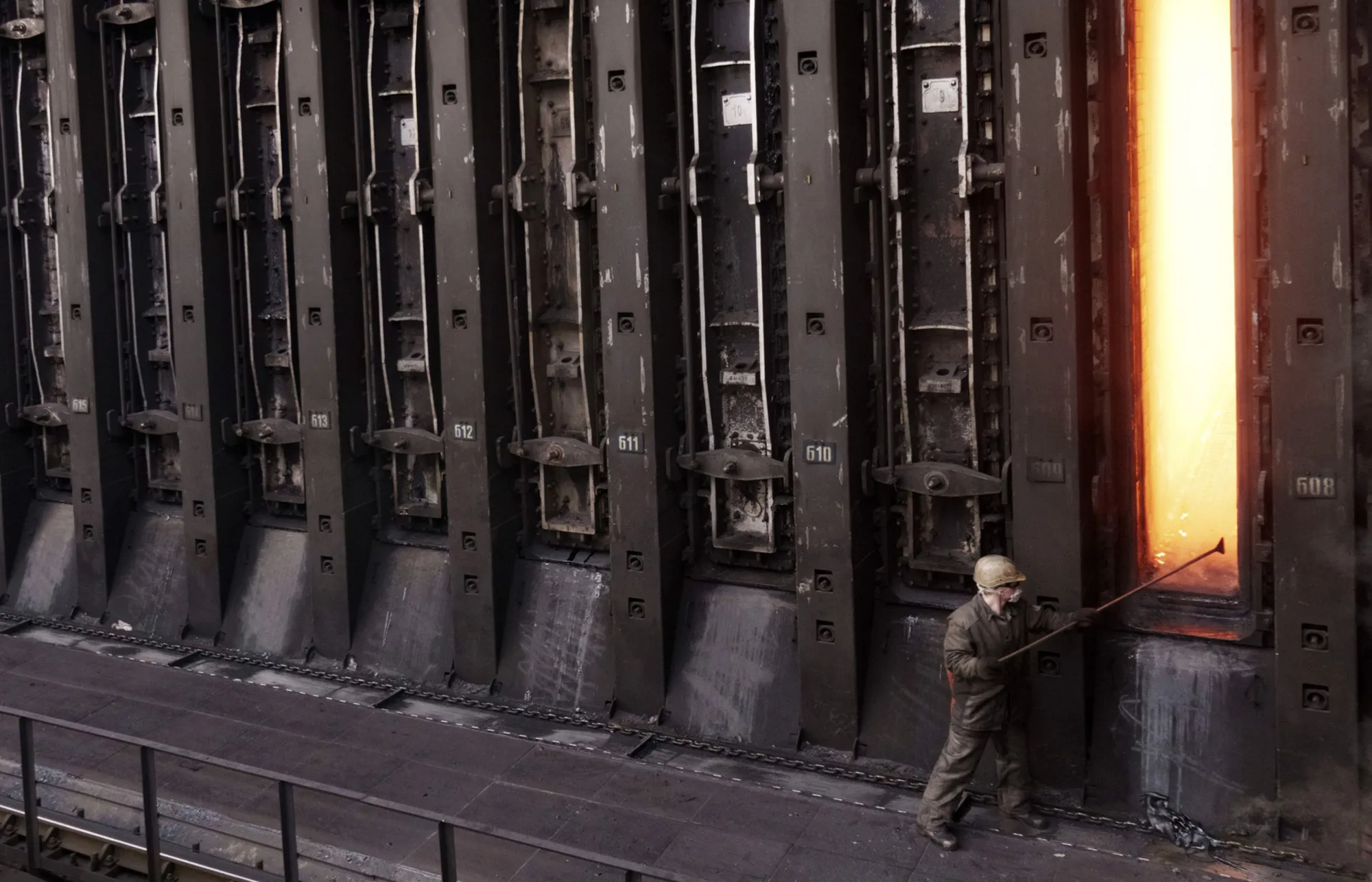 A coke plant worker tends to a battery oven at a&nbsp;steel plant in Kryvyi Rih, Ukraine in 2019.&nbsp;