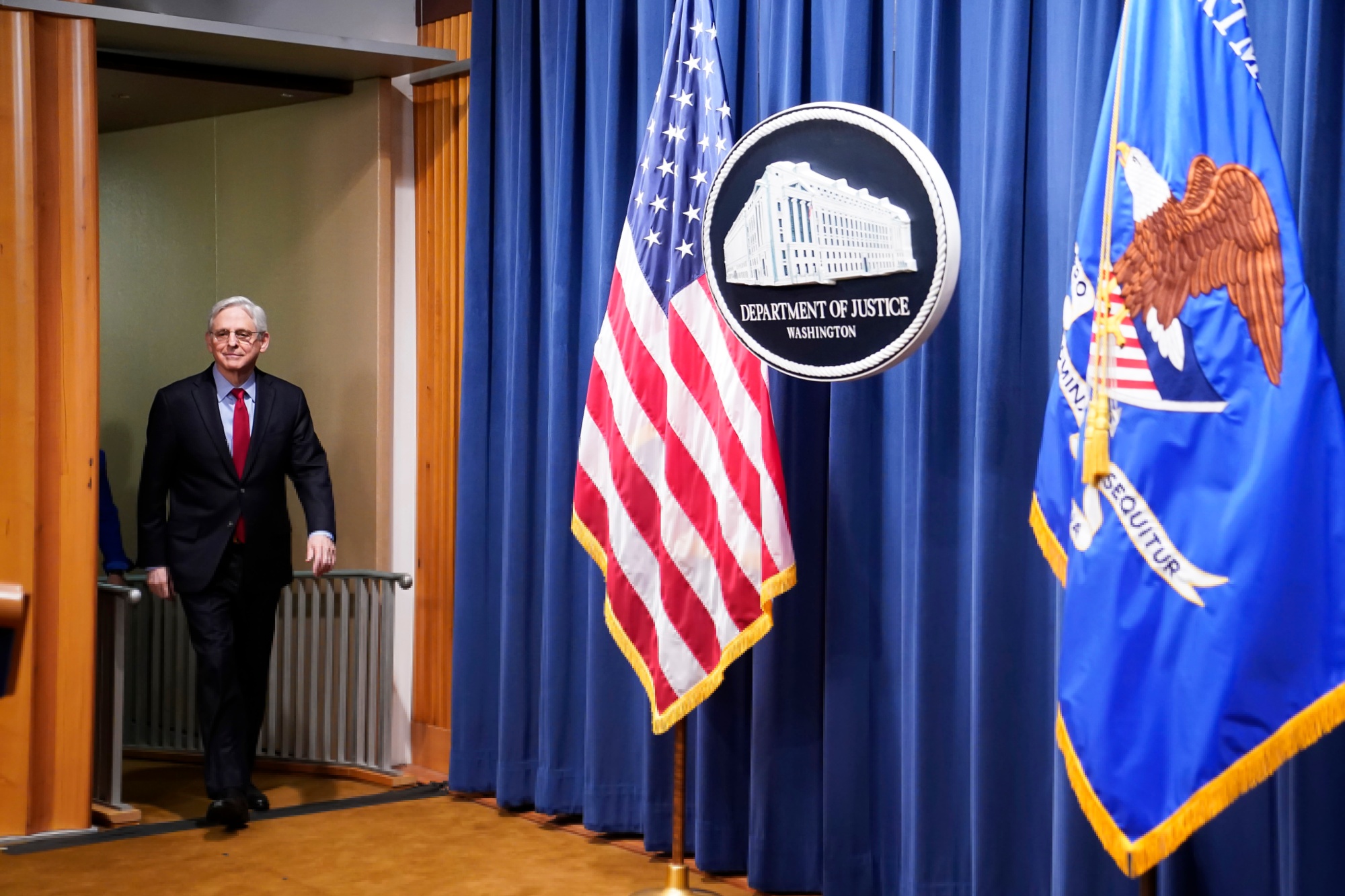 US Attorney General&nbsp;Merrick Garland arrives for a news conference at the Department of Justice in Washington Thursday. The US Justice Department and 16 attorneys general sued Apple, accusing the iPhone maker of violating antitrust laws by blocking rivals from accessing hardware and software features on its devices.
