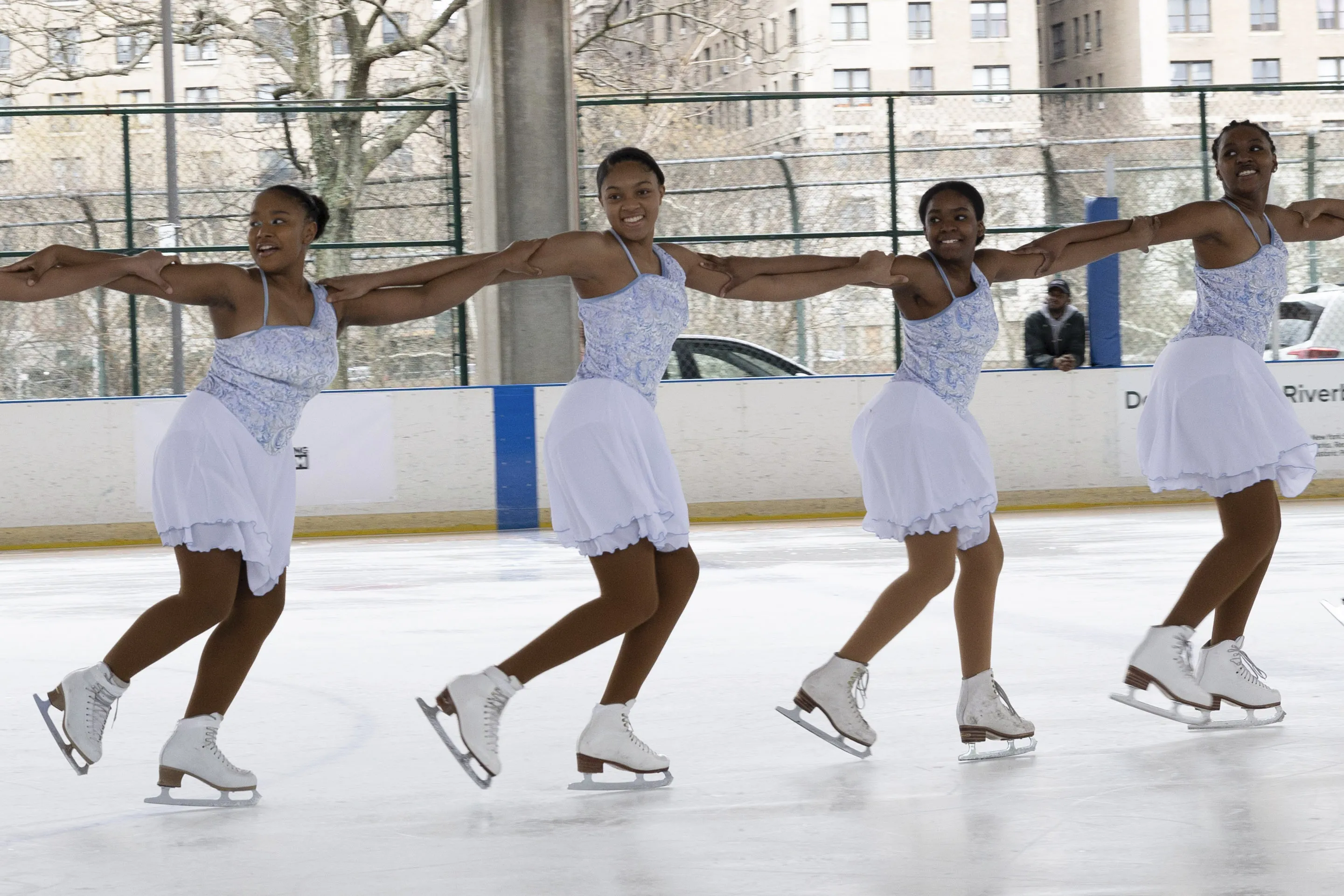 This photo provided by Figure Skating in Harlem shows Figure Skating in Harlem students performing in the 2022 Ice Show, City of Dreams - A Skating Love Letter to NYC at Riverbank State Park in New York, March 20, 2022. The organization’s objective always has been helping girls of color transform their lives by growing in confidence, leadership and academic achievement. (Larua Differender/Figure Skating in Harlem via AP)