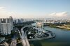 The Singapore Flyer, center, stands among commercial and residential buildings in Singapore, on Sunday, June 4, 2017. After two years of below-par growth, economists and even Singapore's government are becoming more positive on the city-state's outlook. While it's not boom time yet, the consensus is that 2017 growth will come in higher than last year’s 2 percent.