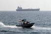 Iranian Revolutionary Guards drive a spe