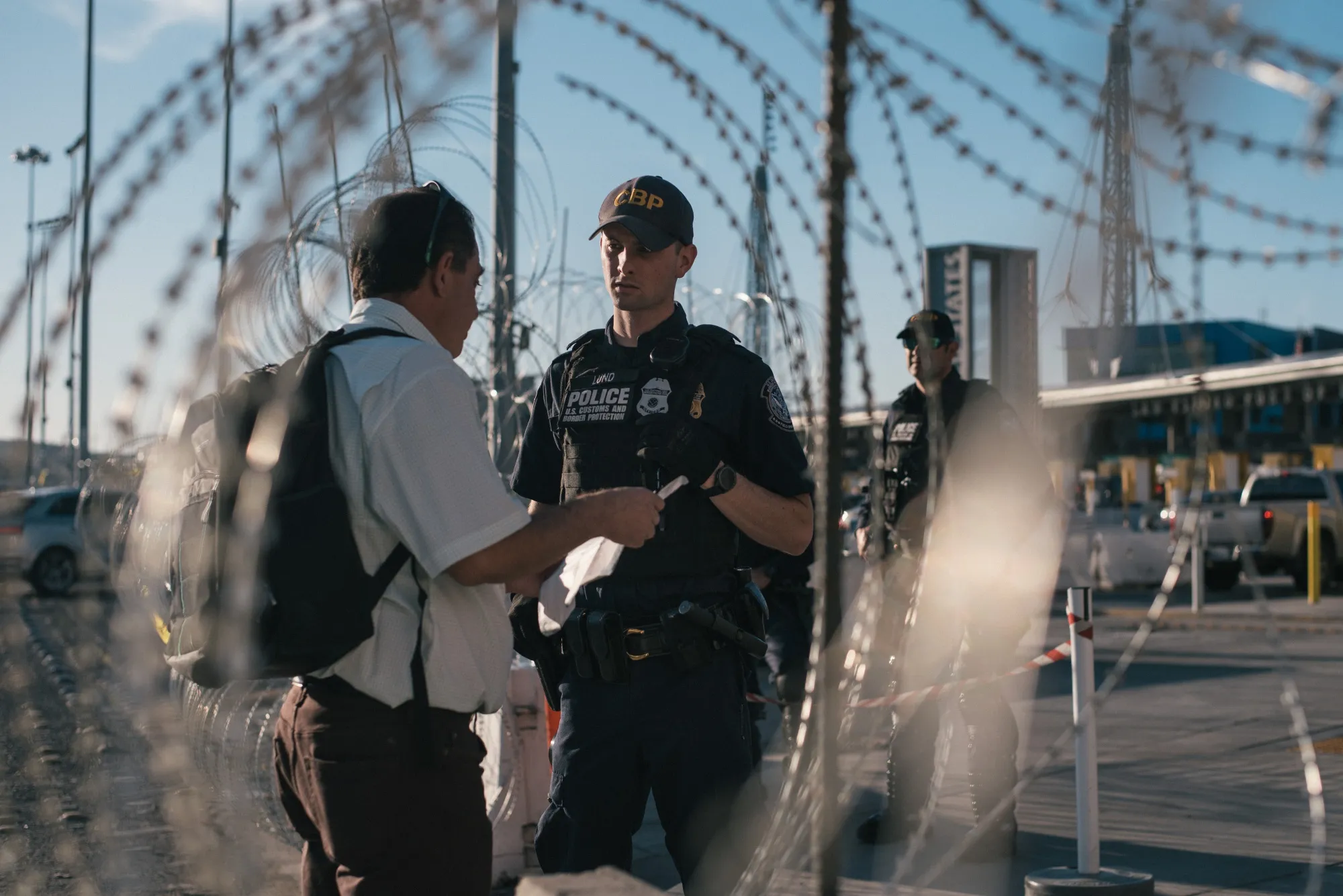 A U.S. Customs and Border Protection&nbsp;officer speaks to a man at the San Ysidro port of entry in Tijuana, Mexico, on&nbsp;Nov. 26, 2018.&nbsp;