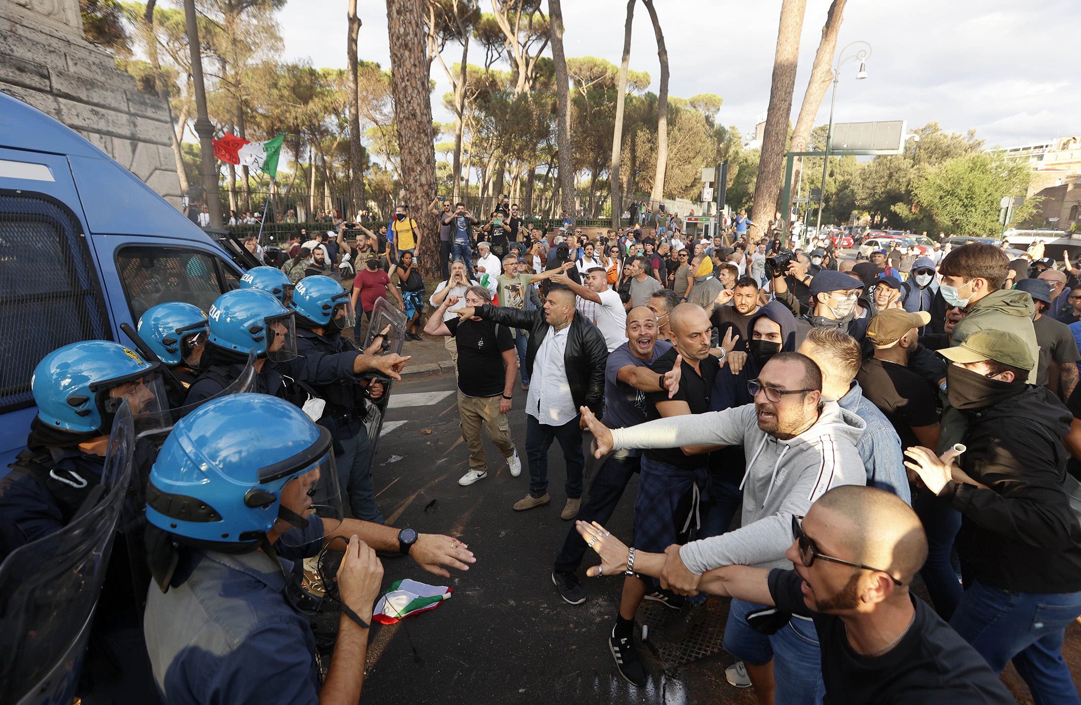 Demonstrators clash with anti-riot police officers during a protest against the obligation of green pass in Rome, Italy, on Oct.&nbsp;9, 2021.&nbsp;