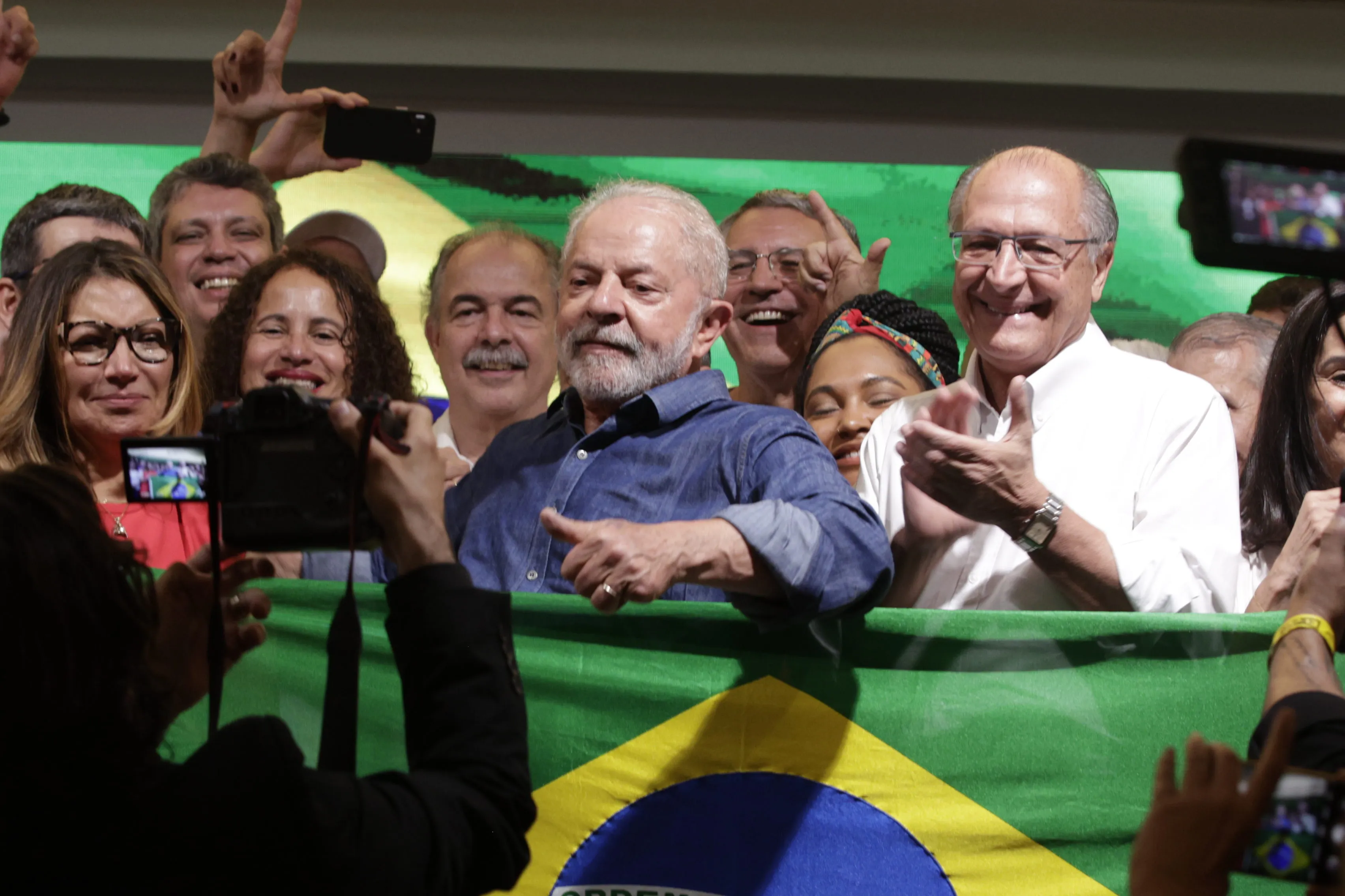 Luiz Inacio Lula da Silva, Brazil's president-elect, center, poses for a photograph after winning the runoff presidential election in Sao Paulo, Brazil, on Sunday, Oct. 30, 2022. Lula won election as Brazil’s president in a dramatic comeback for the left-wing politician who was languishing in a jail cell just three years ago on corruption charges.