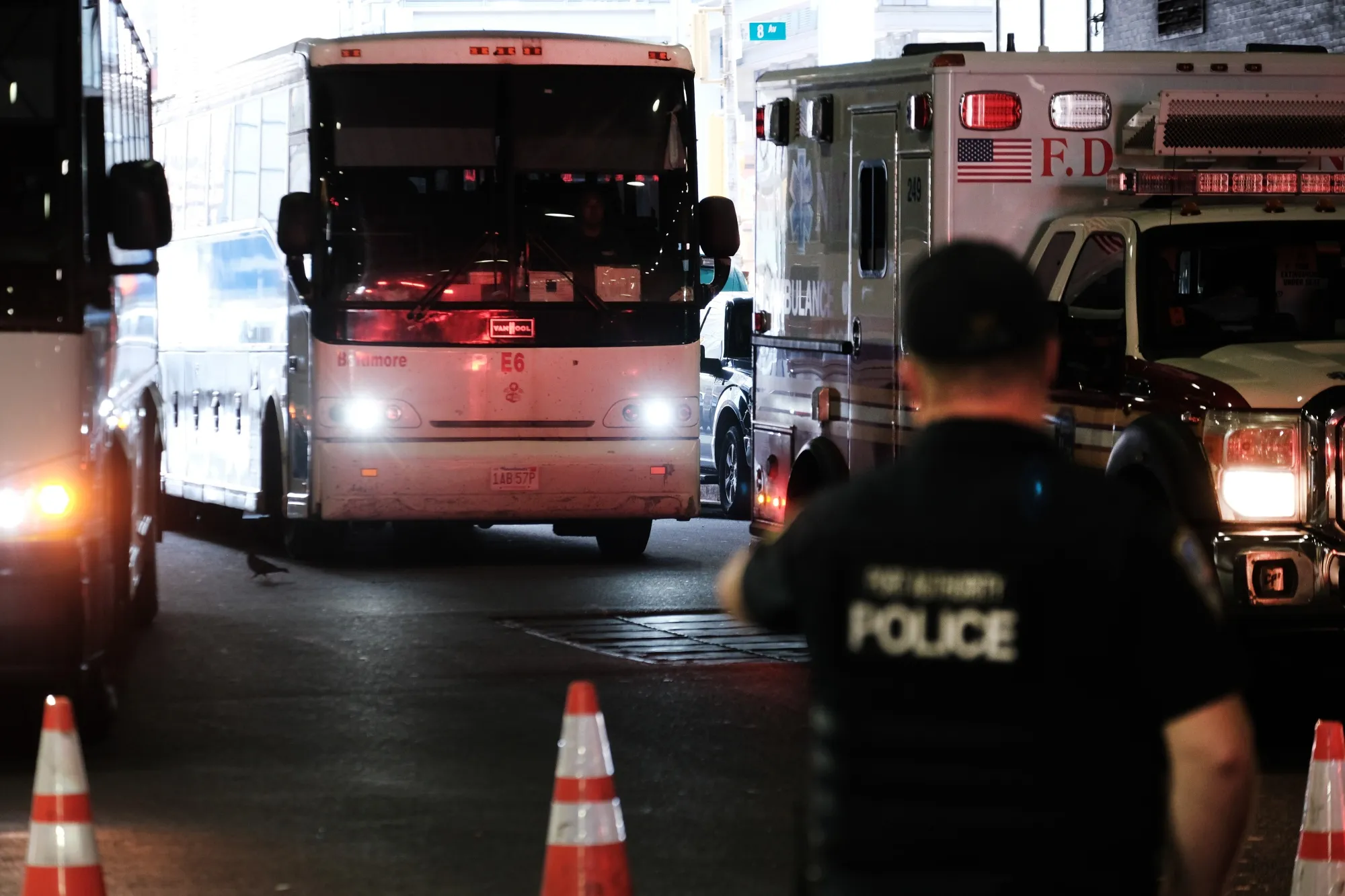 A bus carrying migrants who crossed the border from Mexico into Texas arrives into the Port Authority bus station in New York&nbsp;in 2022.
