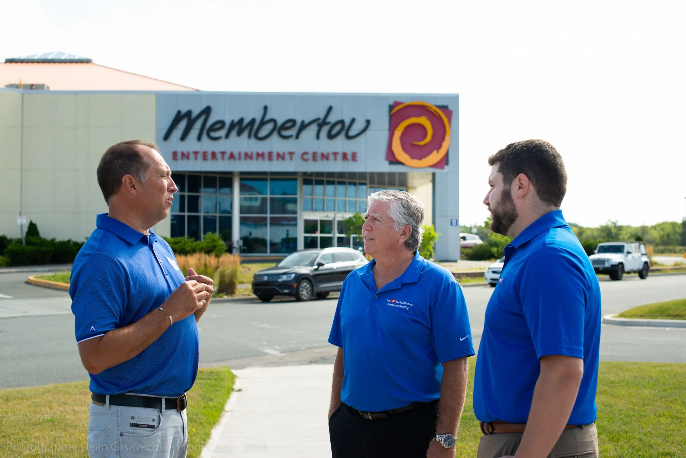 McIntyre, left, meets with BMO managers outside of the Membertou Entertainment Center.