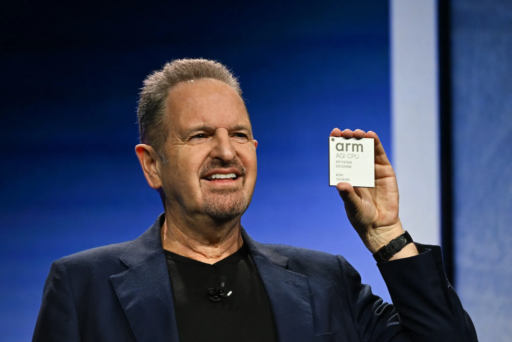 Rene Haas with Arm's AGI CPU chip.