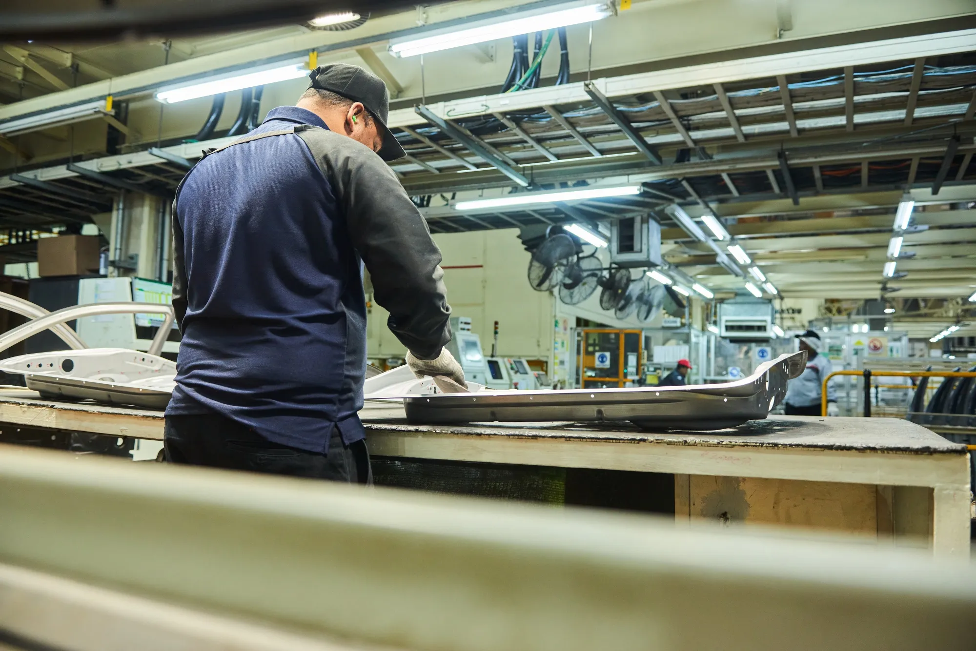 A worker prepares an automobile part at a manufacturing plant in Durban.