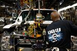 A worker wearing a United Auto Workers (UAW) shirt assembles a Ford Motor Co. Super Duty series pickup truck at the company's truck manufacturing plant in Louisville, Kentucky, U.S., on Tuesday, Dec. 1, 2015.&nbsp;