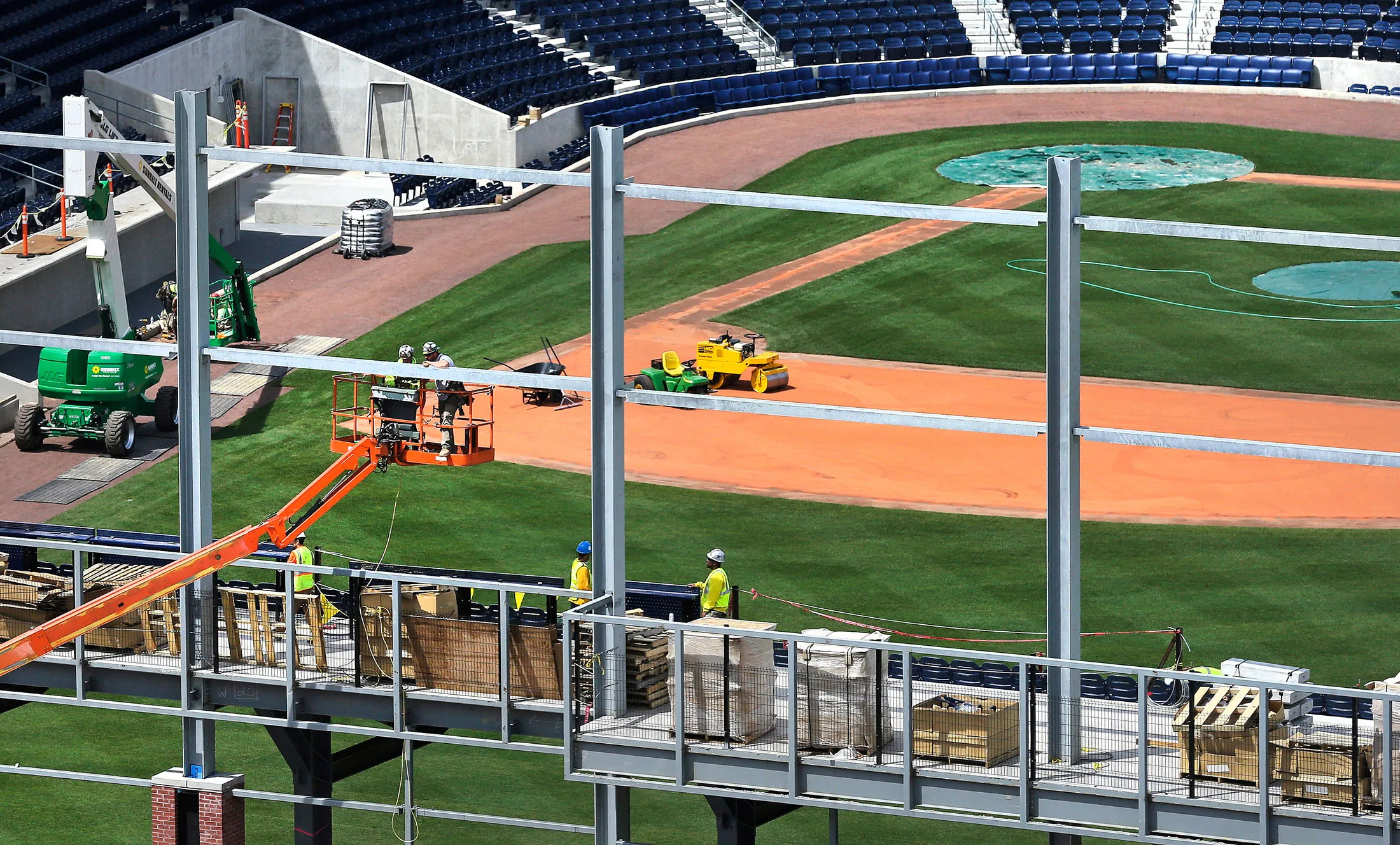 Construction workers build the right-field wall at a stadium for Hartford’s new minor league baseball team on April 25.

