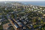Aerial view of the Raizen refinery next to the Rio de la Plata river and backgrounded by Buenos Aires city in Dock Sud, Avellaneda, Buenos Aires province, taken on February 6, 2025. (Photo by JUAN MABROMATA / AFP) (Photo by JUAN MABROMATA/AFP via Getty Images)