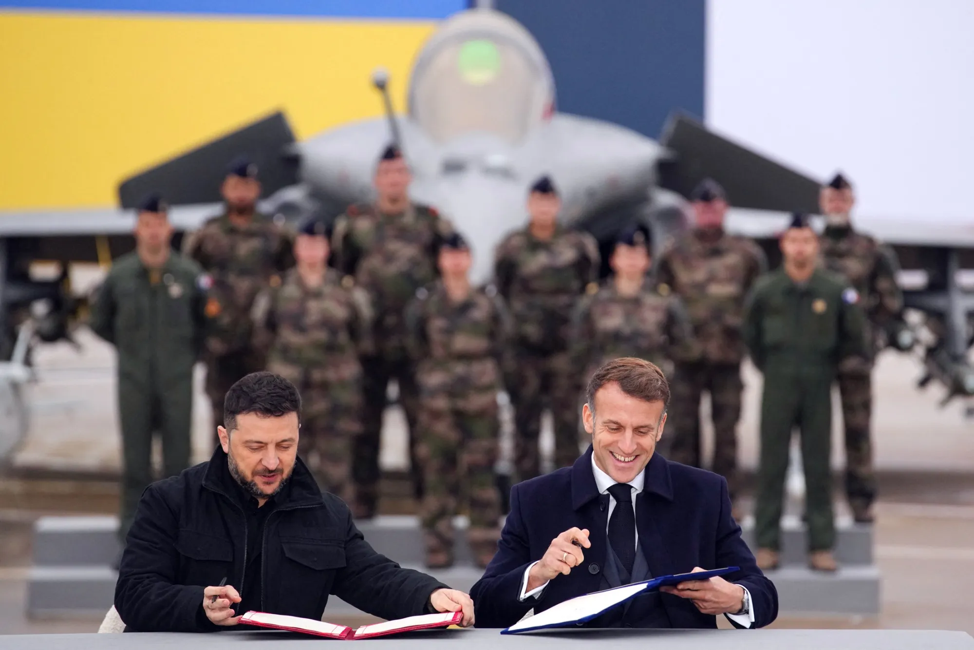 Volodymyr Zelenskiy and Emmanuel Macron during a signing ceremony at Villacoublay air base near Paris, on Nov. 17.
