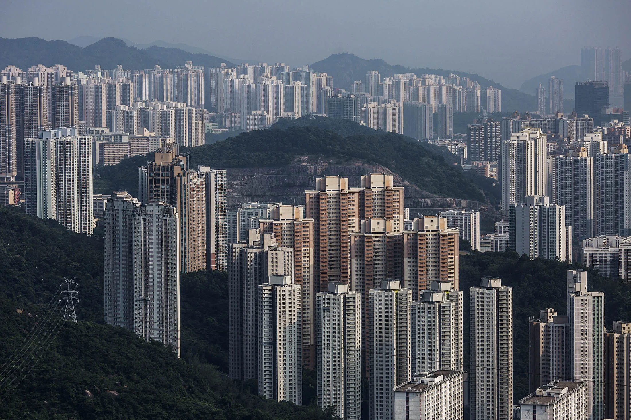 Residential buildings stand in the Choi Hung, front, and the Tseung Kwan O district, back, of Hong Kong, China, on Tuesday, Aug. 25, 2015. Prices of existing homes have risen 9 percent this year in Hong Kong, according to Centaline Property Agency Ltd.
