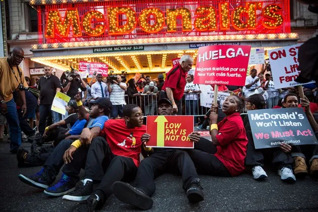 Protesters demanding higher wages and unionization for fast food workers block traffic near Times Square on Sept. 4, 2014 in New York City.