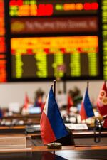 The Philippine national flag sits on a trader's desk on the floor of the Philippine Stock Exchange in Manila, the Philippines
