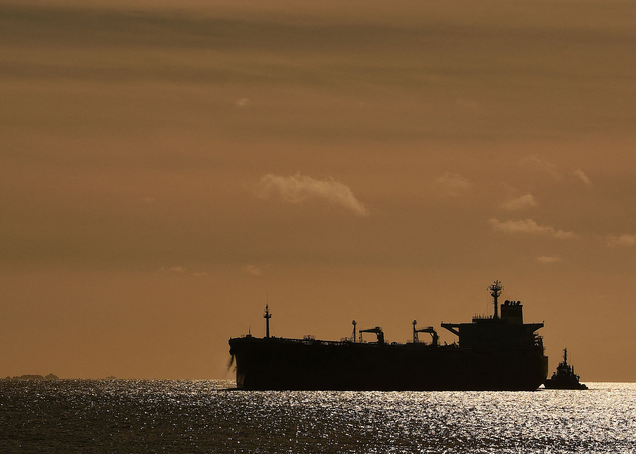 An oil tanker against the sunset.